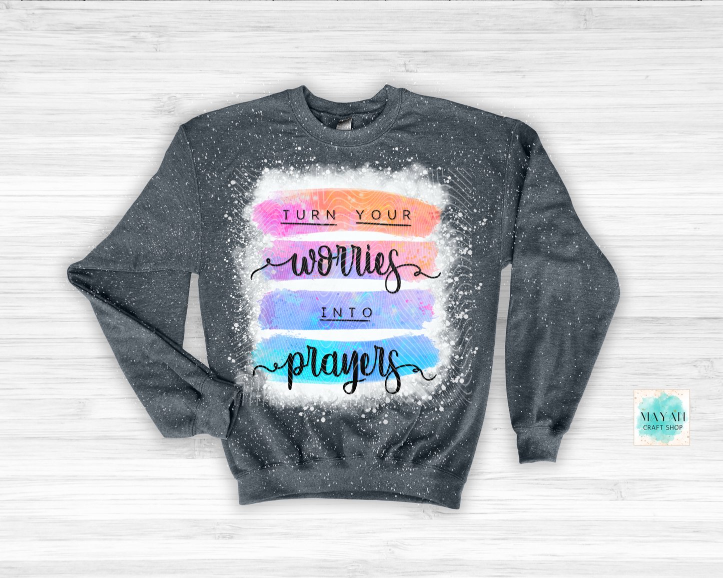 Gray sweatshirt with colorful text design on a light gray background