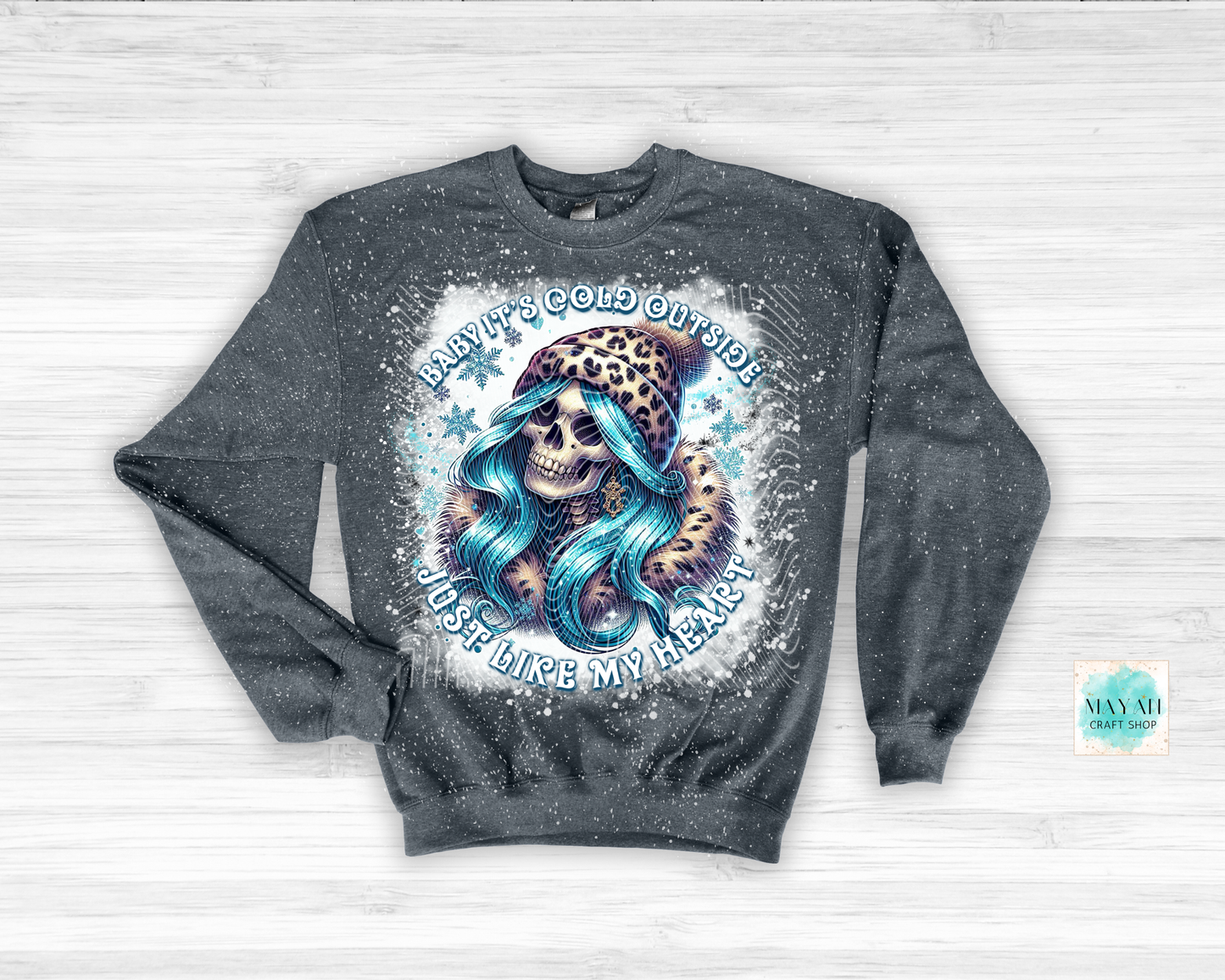 Gray sweatshirt with a graphic design of a skull with blue hair and a leopard, on a light gray background.