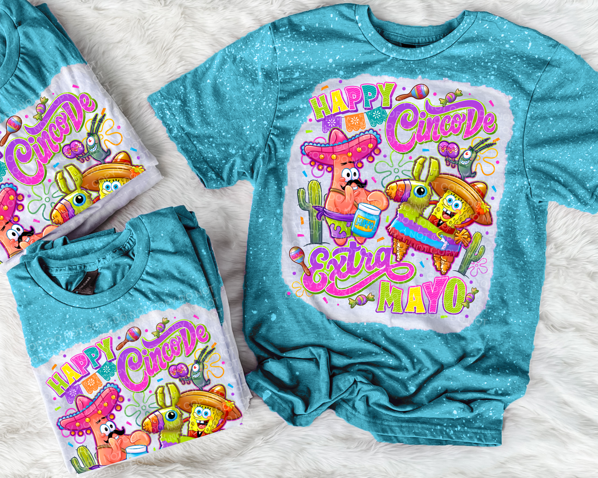 Turquoise t-shirt with 'Happy Cinco de Mayo' design featuring cartoon characters on a textured surface.