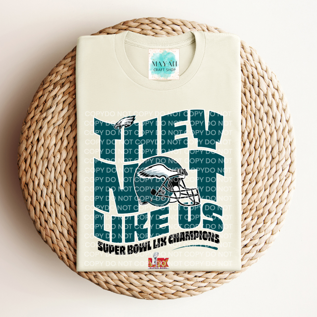 SB 2025 champs not like us heather natural shirt. -Mayan Craft Shop