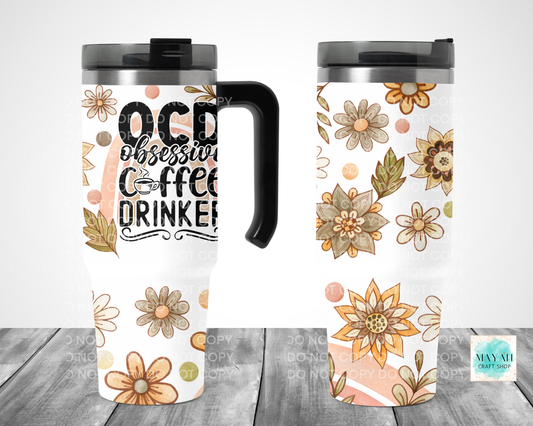 Two travel mugs with floral designs and text on a white background