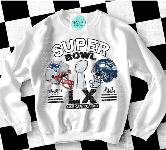 White sweatshirt withfootball themed design featuring football helmets and event details on a checkered background.