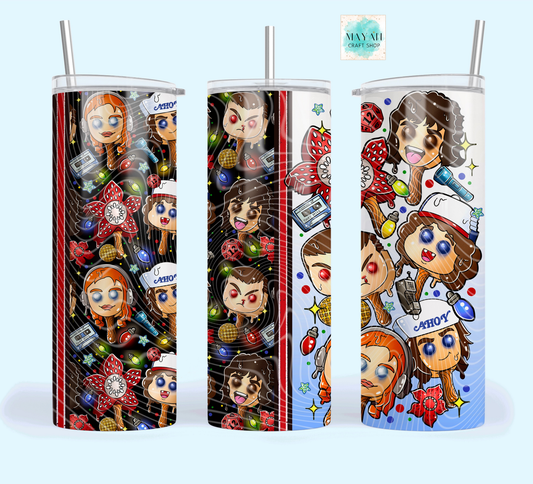 Three tumblers with colorful character designs on a white background