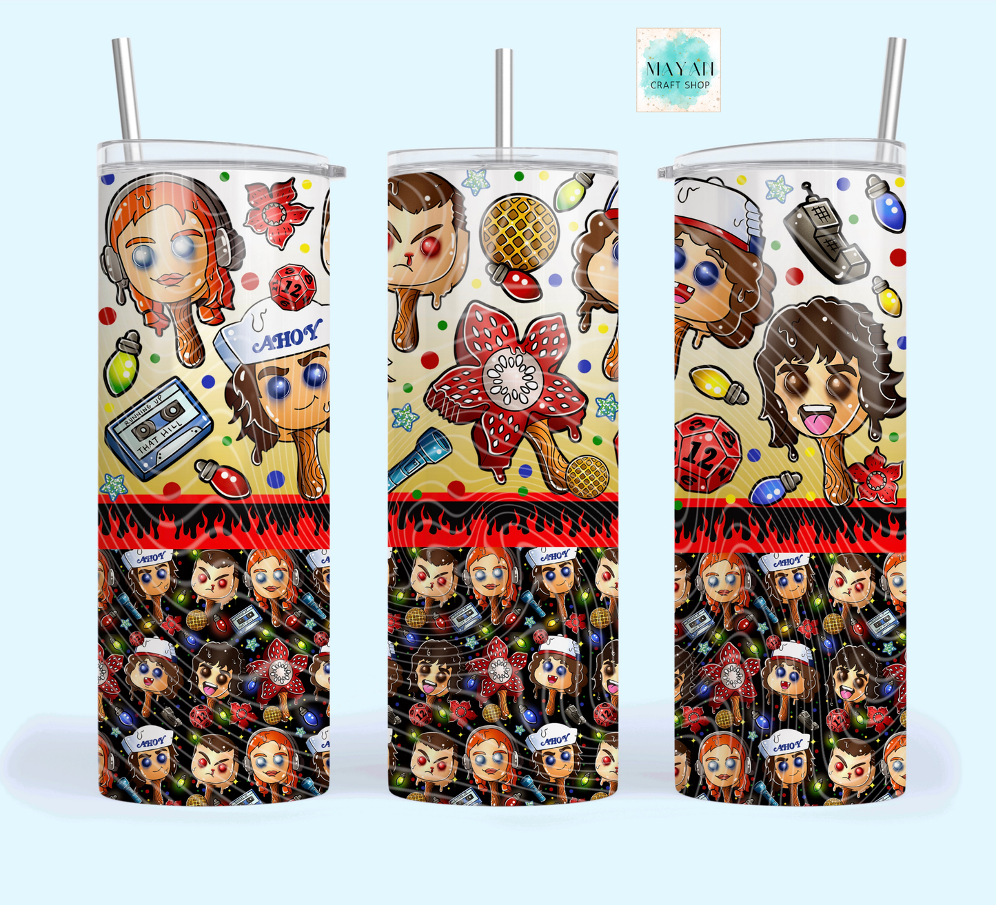 Three colorful tumblers with character designs on a white background