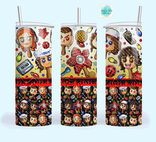 Three colorful tumblers with character designs on a white background