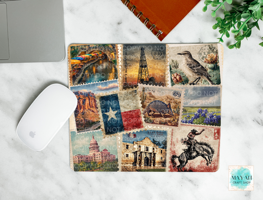 Decorative mouse pad with Texas-themed design on a marble surface.