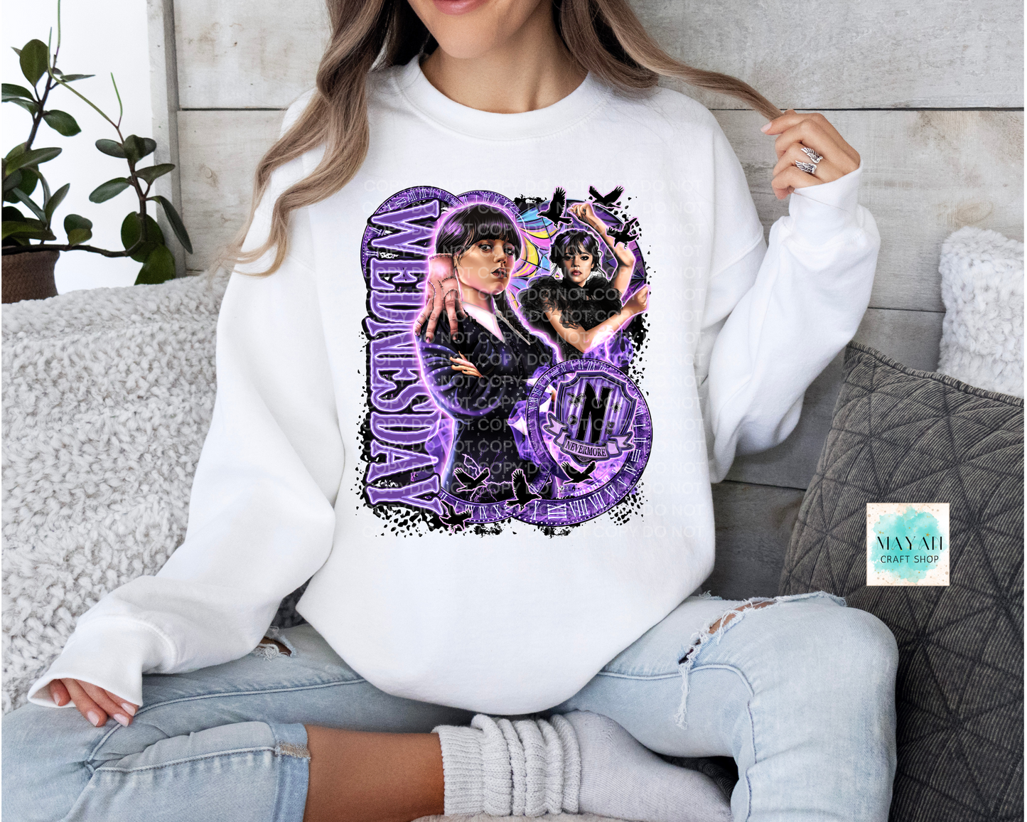 Purple design on white sweatshirt.
