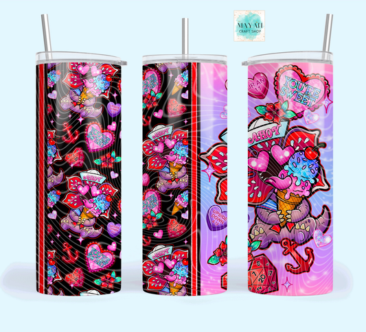 Three colorful tumblers with designs featuring hearts, ice cream cones, and abstract patterns on a white background.
