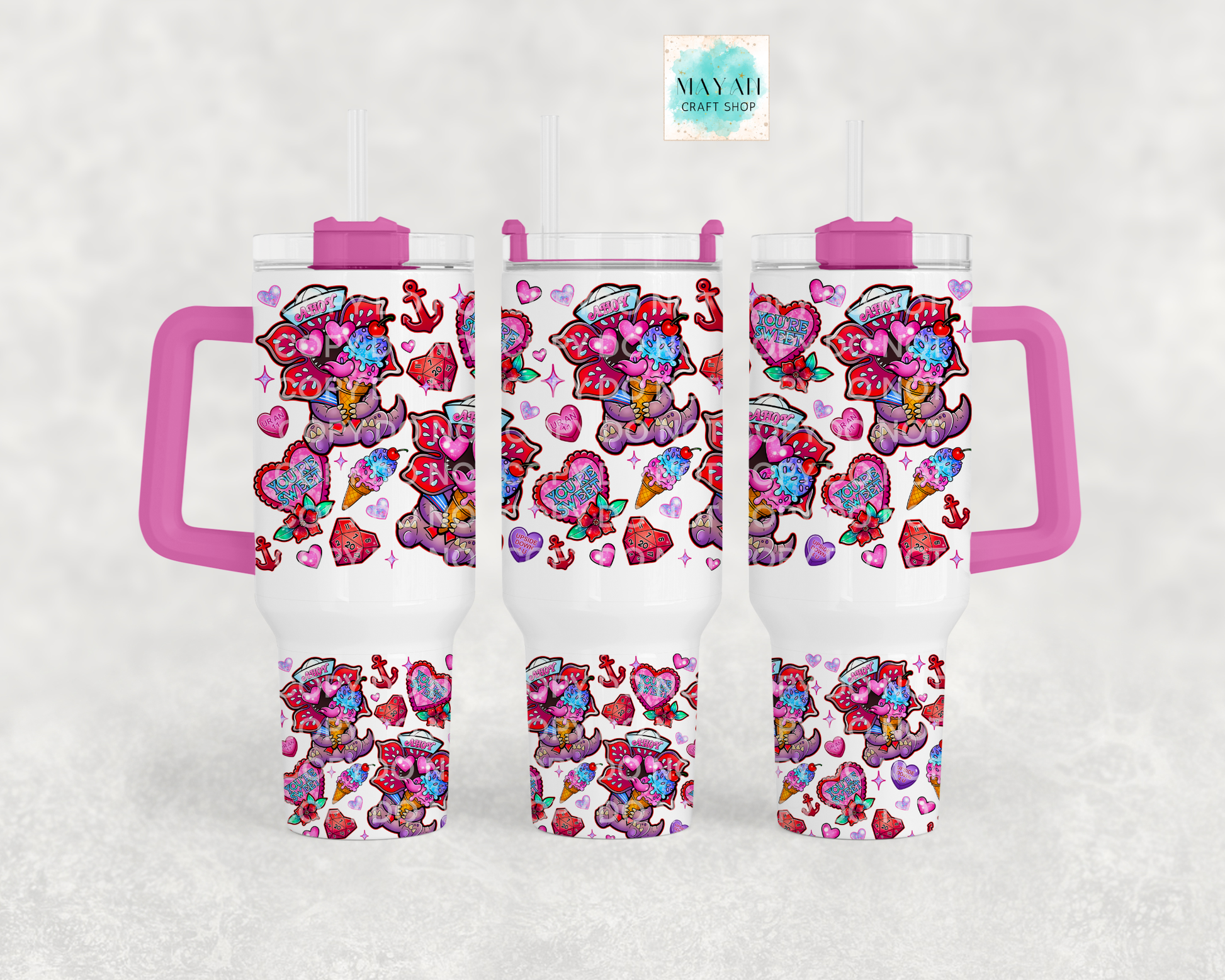 Set of personalized tumblers with colorful designs and handles on a white background.
