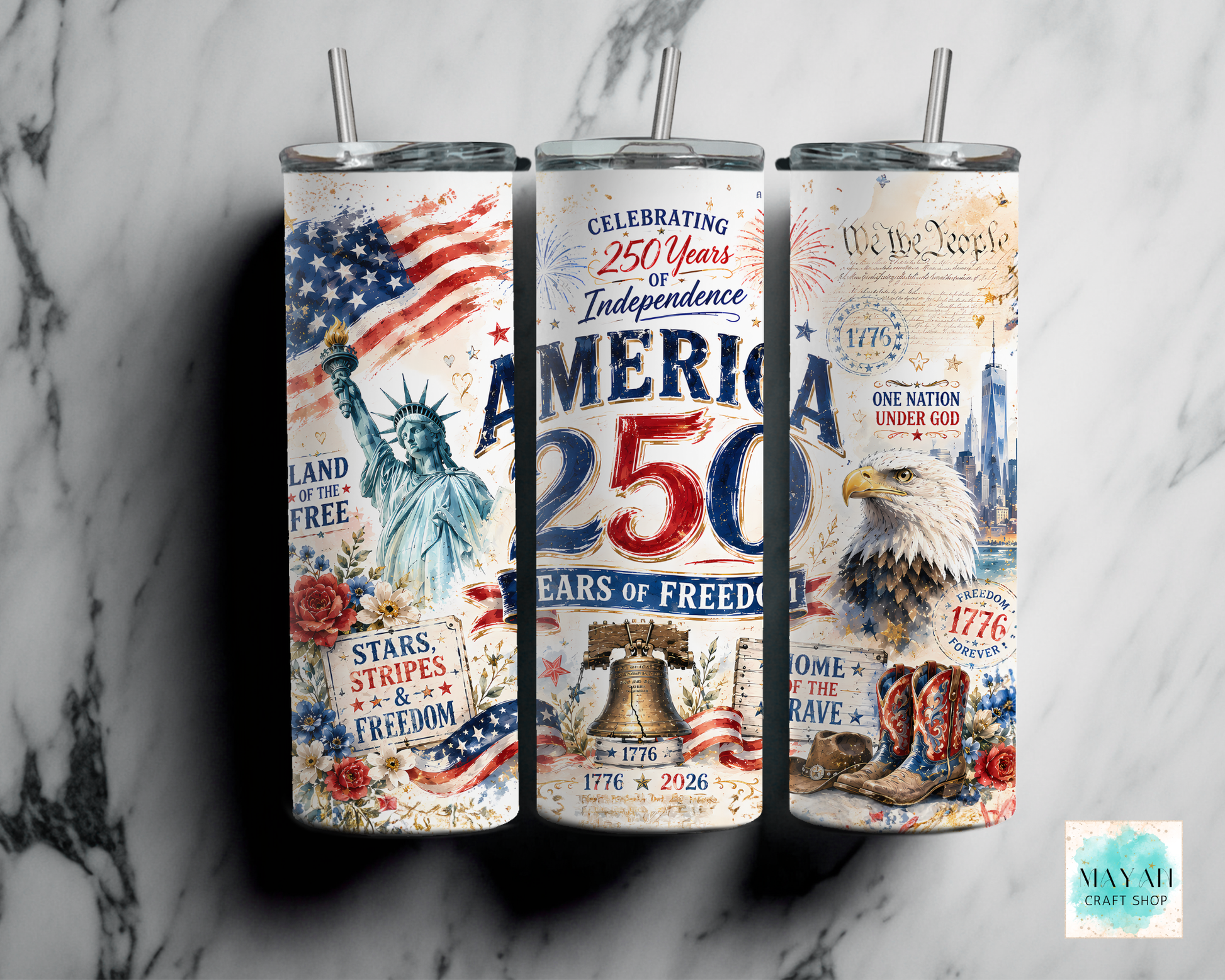 Three tumblers with American-themed designs on a marble surface
