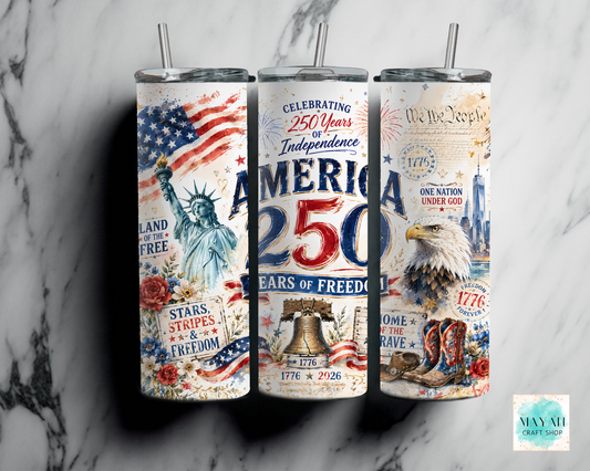 Three tumblers with American-themed designs on a marble surface