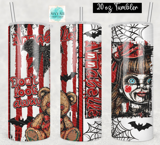 Three views of a 20 oz skinny tumbler with a Halloween-themed horror design a doll, a teddy bear, bats, spiderwebs, and red-and-white vertical stripes. The tumbler has a clear lid with a metal straw.