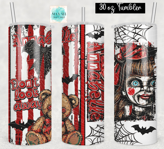 Three views of a 30 oz skinny tumbler with a Halloween-themed horror design featuring a spooky doll, a teddy bear, bats, spiderwebs, and red-and-white vertical stripes. The tumbler has a clear lid with a metal straw.