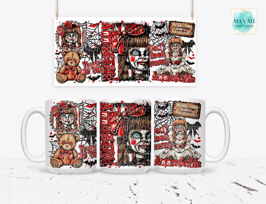 A white ceramic mug shown from multiple angles with a horror-themed printed design featuring a creepy doll, teddy bear, spiderwebs, and red text. 