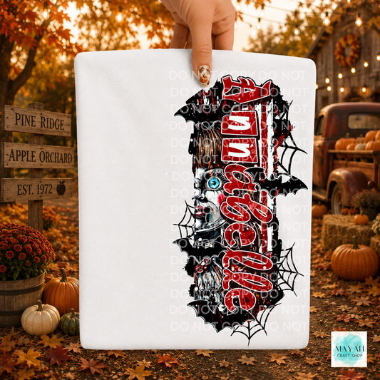A white rectangular sign or board held by a hand, featuring a large Halloween-themed graphic in red and white, bats, spiders, and a skull. The background is a fall yard scene with pumpkins, autumn leaves, and a rustic truck.