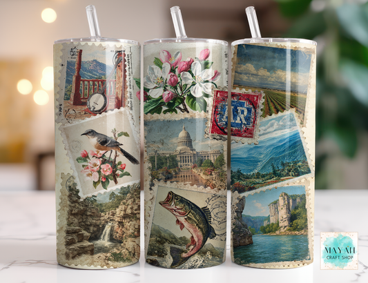 Three cylindrical tumblers with vintage-style images on a blurred background