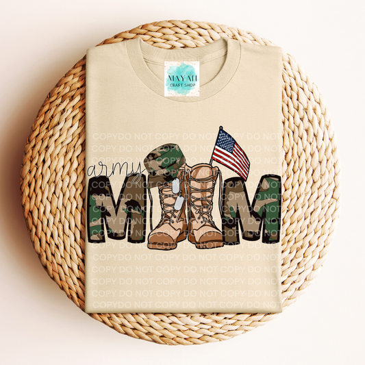 Beige t-shirt with military mom design featuring boots, a flag, and camouflage on a woven surface.