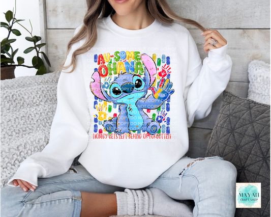 Person wearing a white sweatshirt with a colorful character design and text.