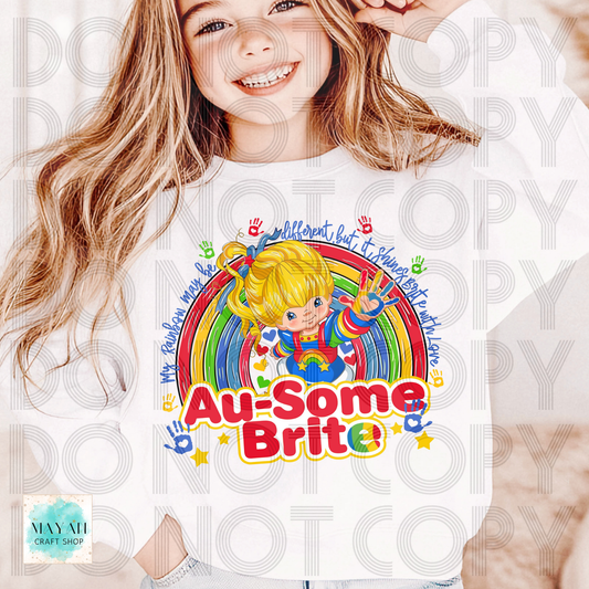 Child wearing a shirt with a colorful design and text, sitting on a white background.