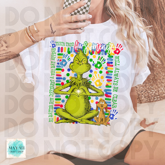 Person wearing a t-shirt with a green character and text design.