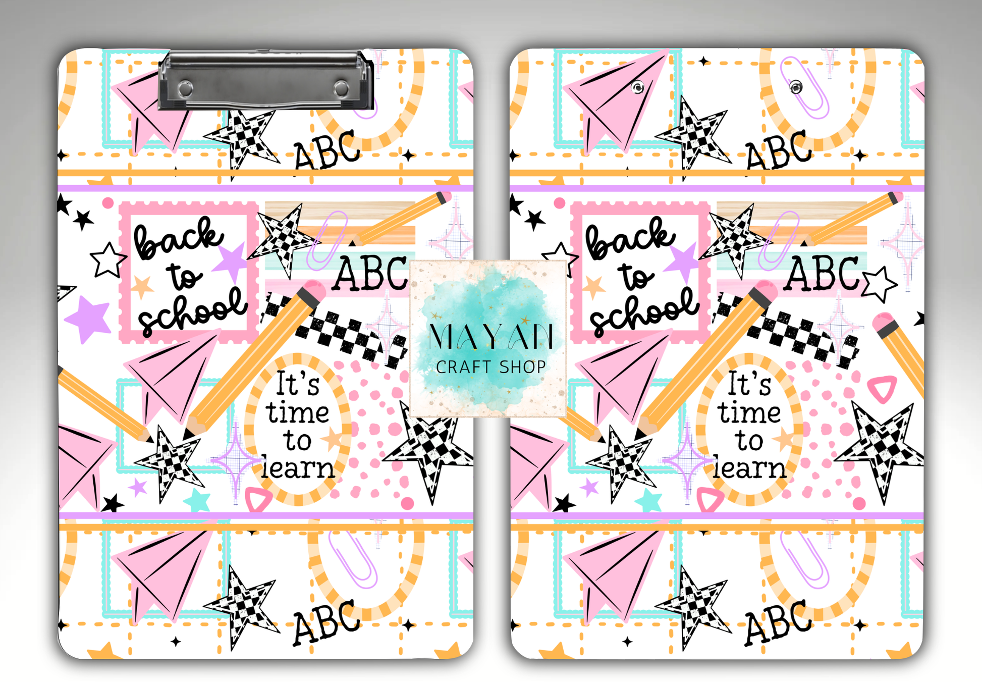 Two matching clipboards with a colorful 'Back to School' pattern, featuring pink paper airplanes, yellow pencils, checkered stars, and the text 'back to school', 'It's time to learn', and 'ABC'. 