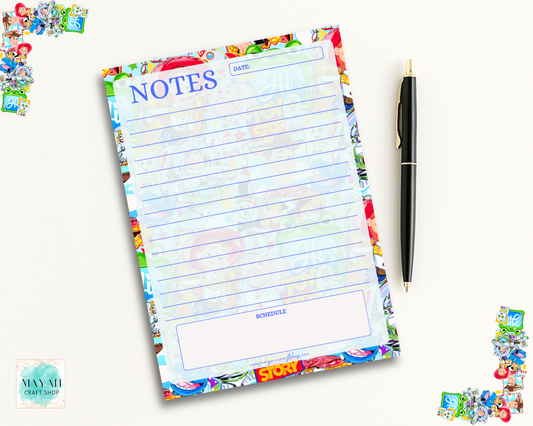 Colorful notepad with cartoon character border and a pen on a white background