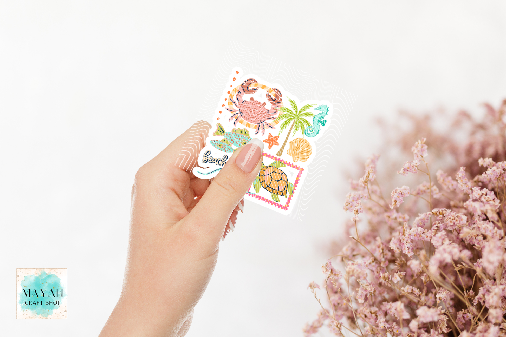 Hand holding a set of colorful stickers with nature-themed designs on a white background.