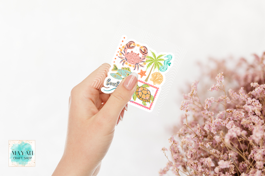 Hand holding a set of colorful stickers with nature-themed designs on a white background.