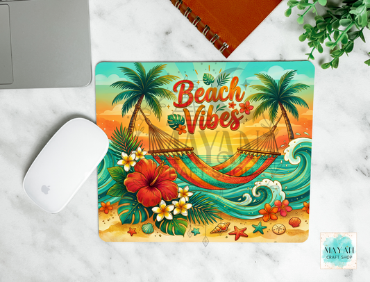 Mouse pad with 'Beach Vibes' design featuring palm trees, hammocks, and flowers on a marble surface.