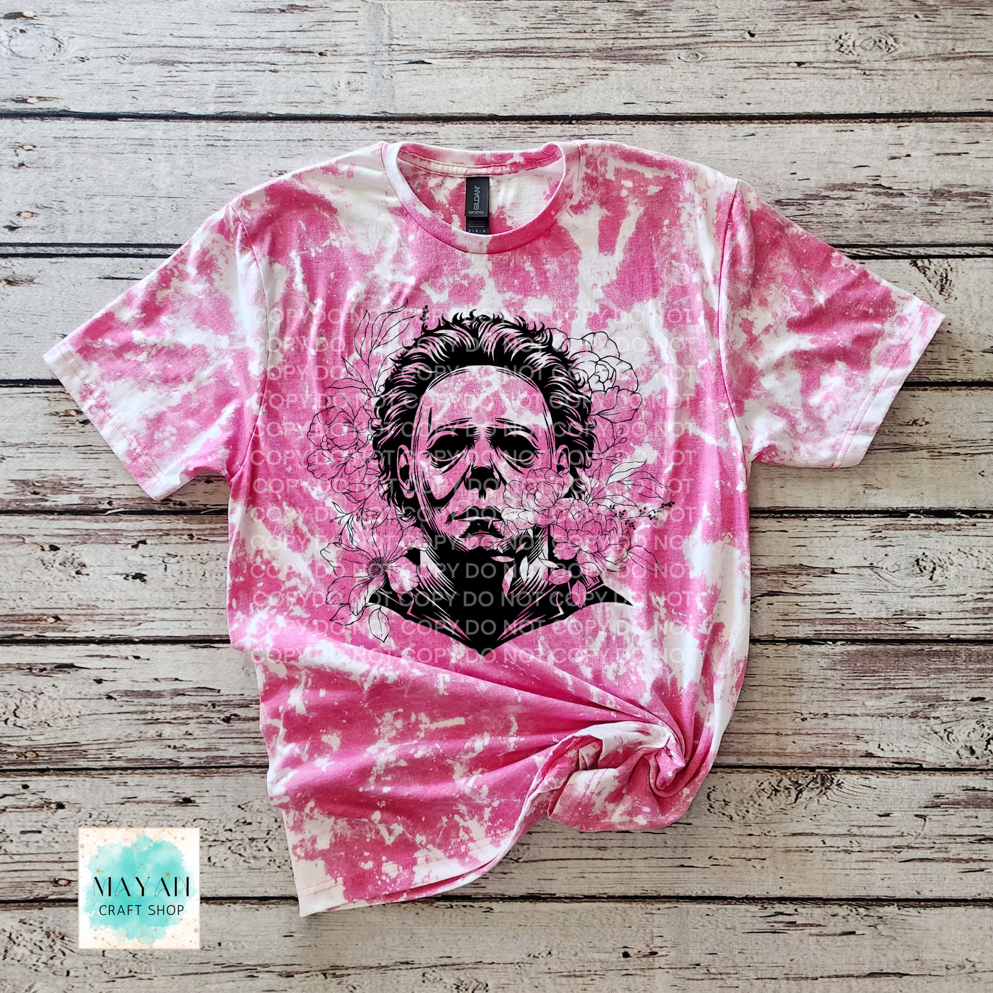 Berry bleached t-shirt with a graphic design on a wooden surface