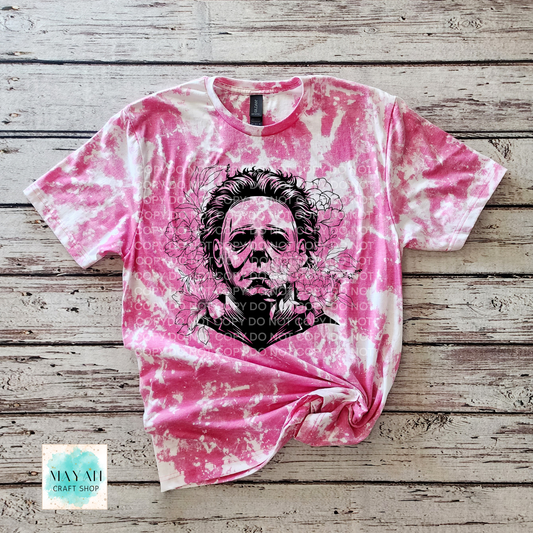 Berry bleached t-shirt with a graphic design on a wooden surface