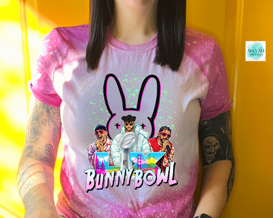 Person wearing a t-shirt with 'Bunny Bowl' design and colorful text on a yellow background