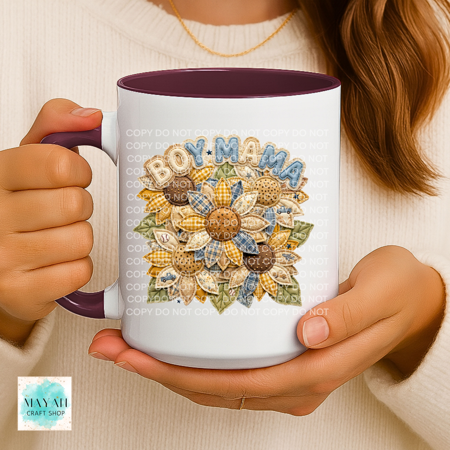 Person holding a mug with 'BOY MAMA' design featuring sunflowers.