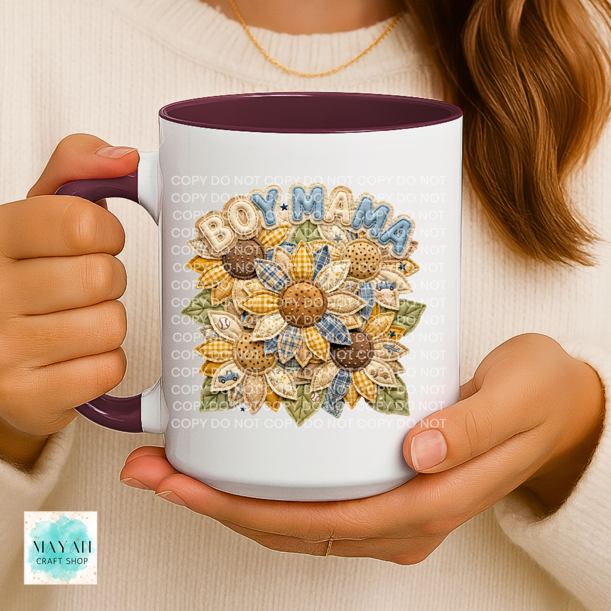 Person holding a mug with 'BOY MAMA' design featuring sunflowers.