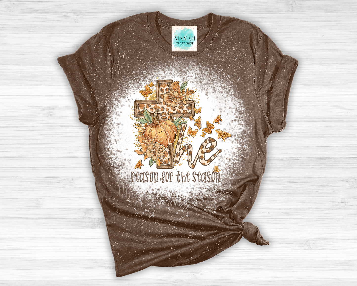 Brown t-shirt with a graphic design featuring a cross, pumpkin, and text on a white background