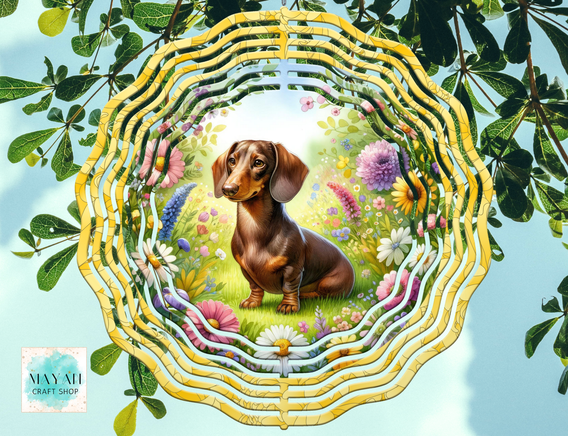 Decorative wind spinner with a dachshund surrounded by flowers and leaves.