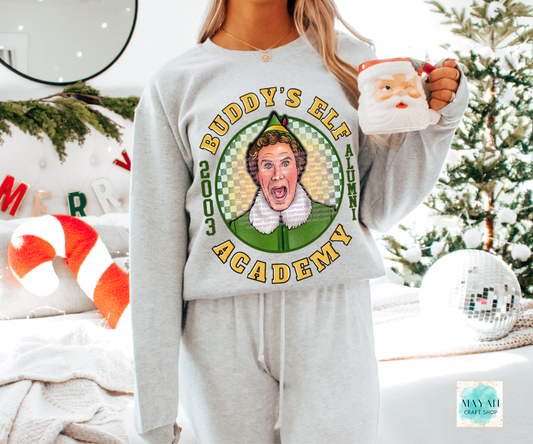 Person wearing a sweatshirt with 'Academy' graphic, holding a mug in a festive setting.