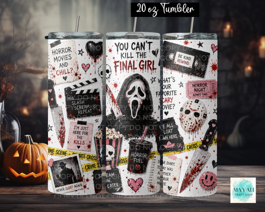 Three 20 oz tumblers with a horror movie collage design, displayed on a wooden surface with a jack-o'-lantern and a dark, spooky background. The tumblers feature graphics from classic horror villains with quotes.