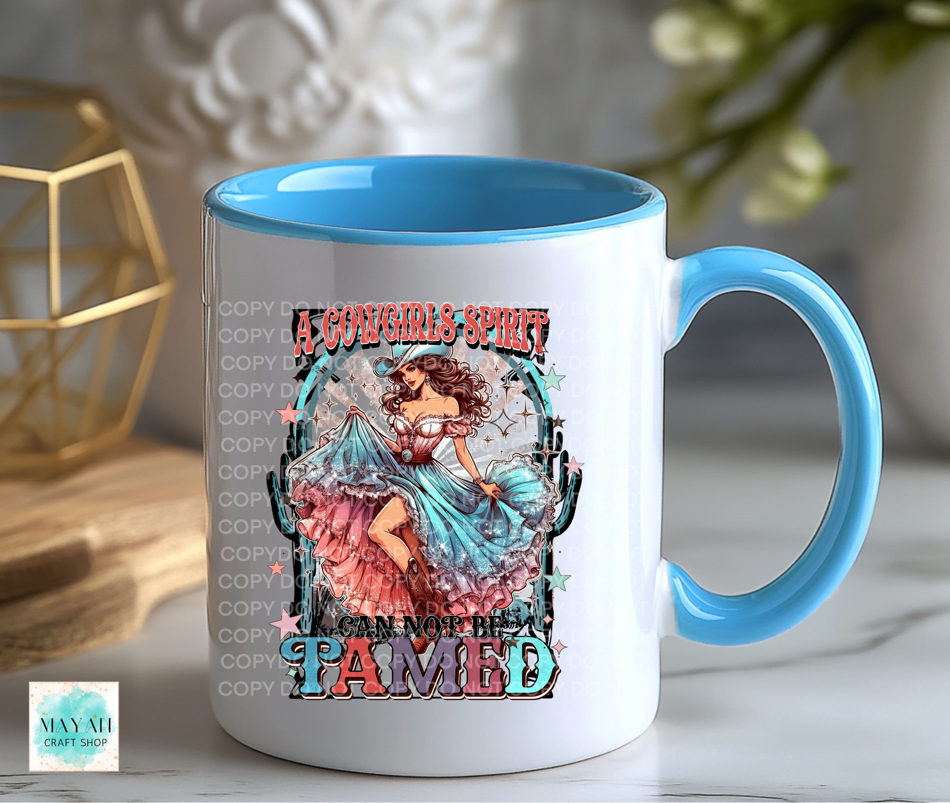 Mug with a colorful design of a woman in a dress surrounded by cacti, with text on a white surface.