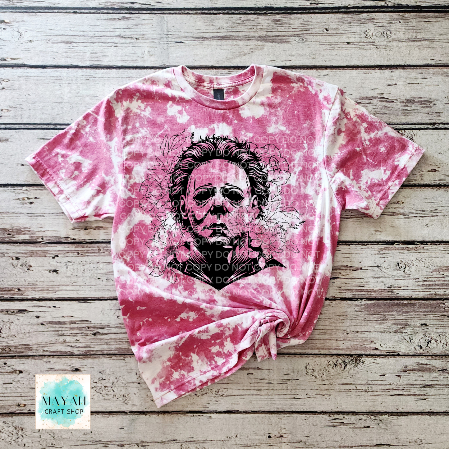 Cardinal red bleached t-shirt with a graphic design on a wooden surface