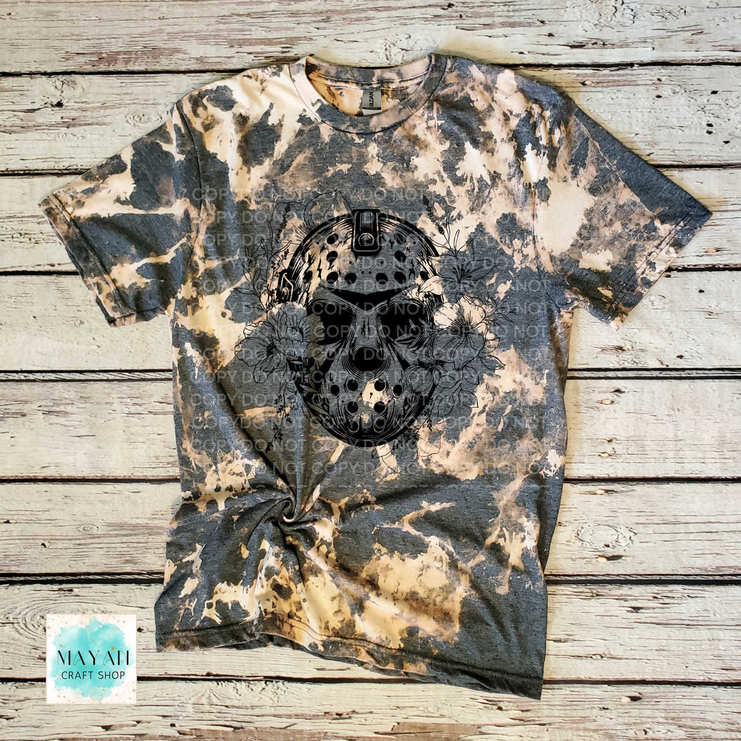 Bleached t-shirt with skull design on a wooden surface
