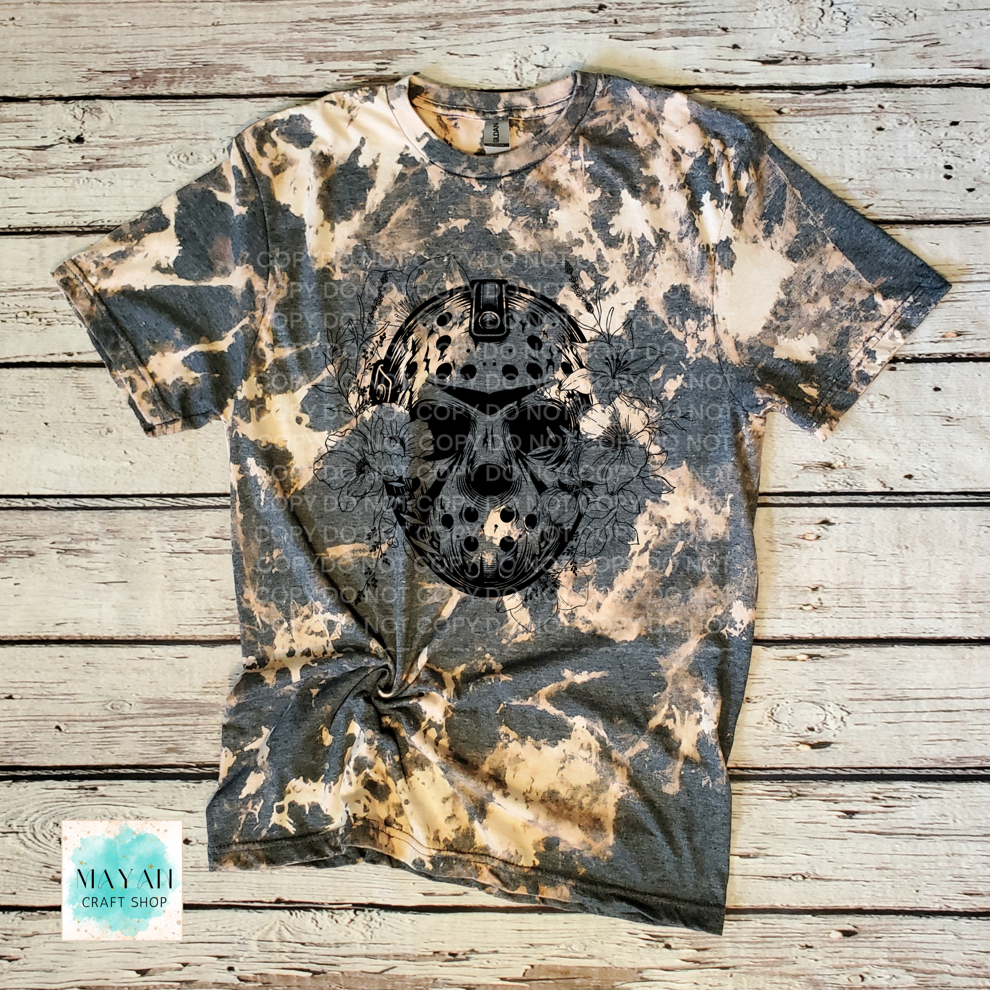 Bleached t-shirt with skull design on a wooden surface