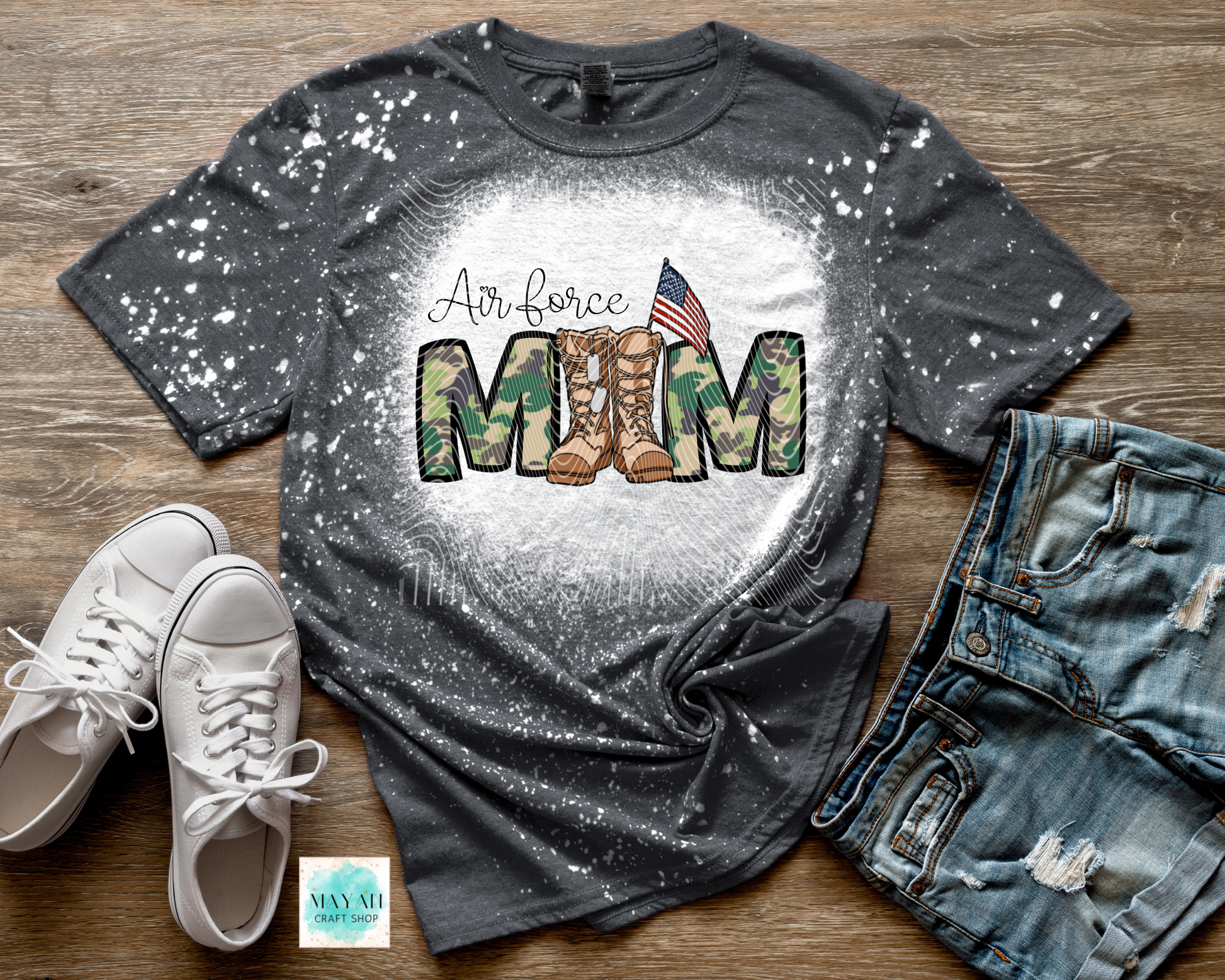Charcoal t-shirt with military mom design on a wooden surface with shoes and jeans.