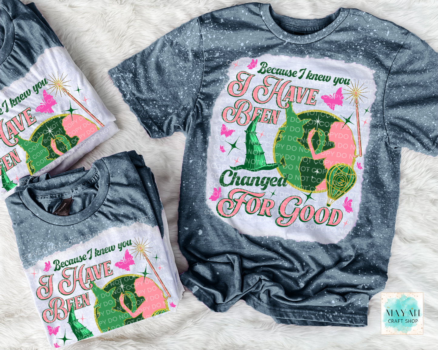 Gray t-shirt with colorful graphic design and text on a white background