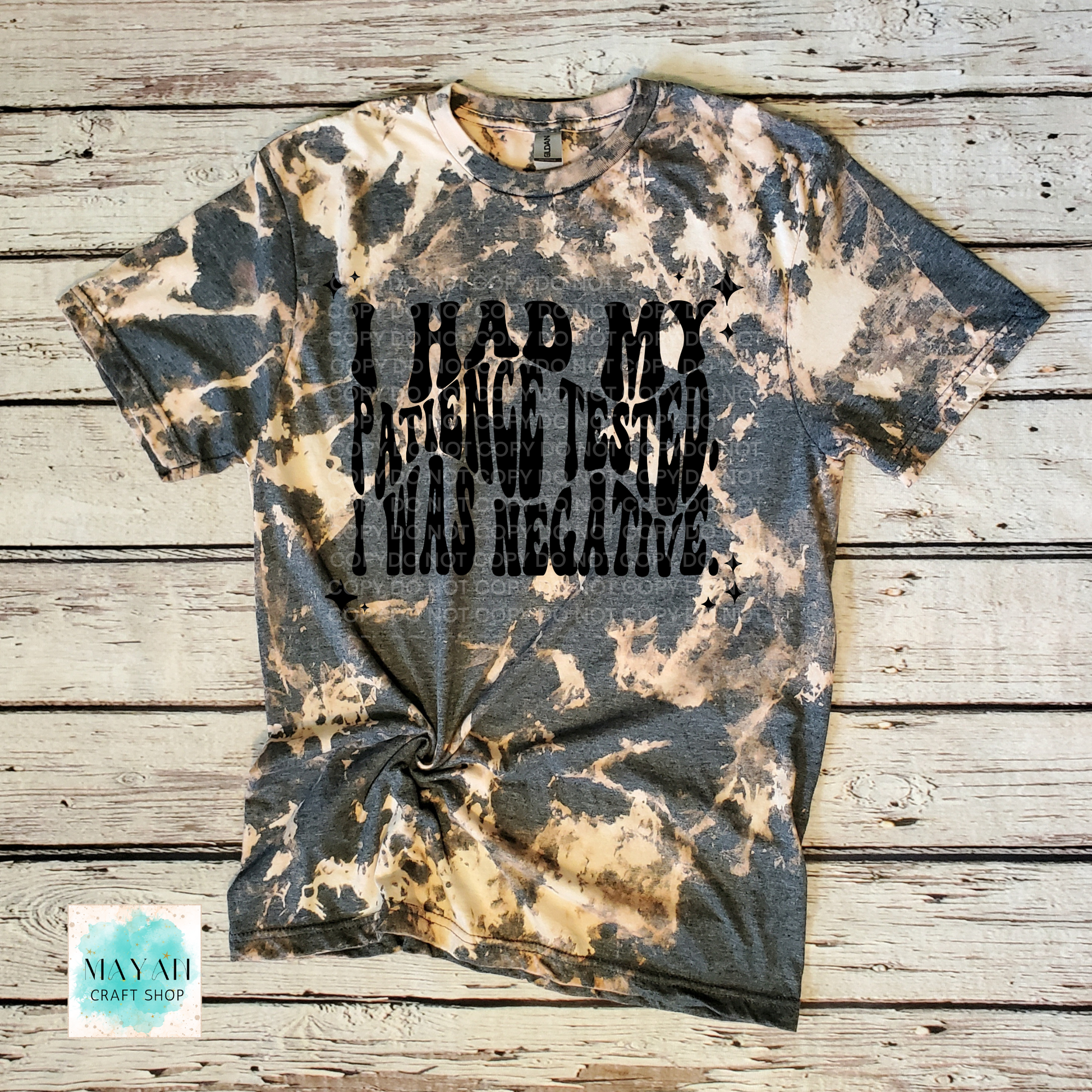 Bleached t-shirt with text on a wooden surface