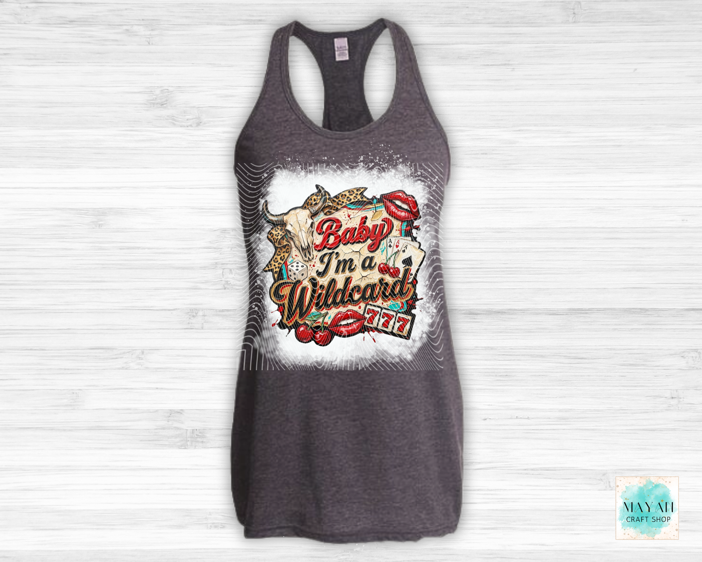 Gray tank top with colorful graphic design on a white wooden background