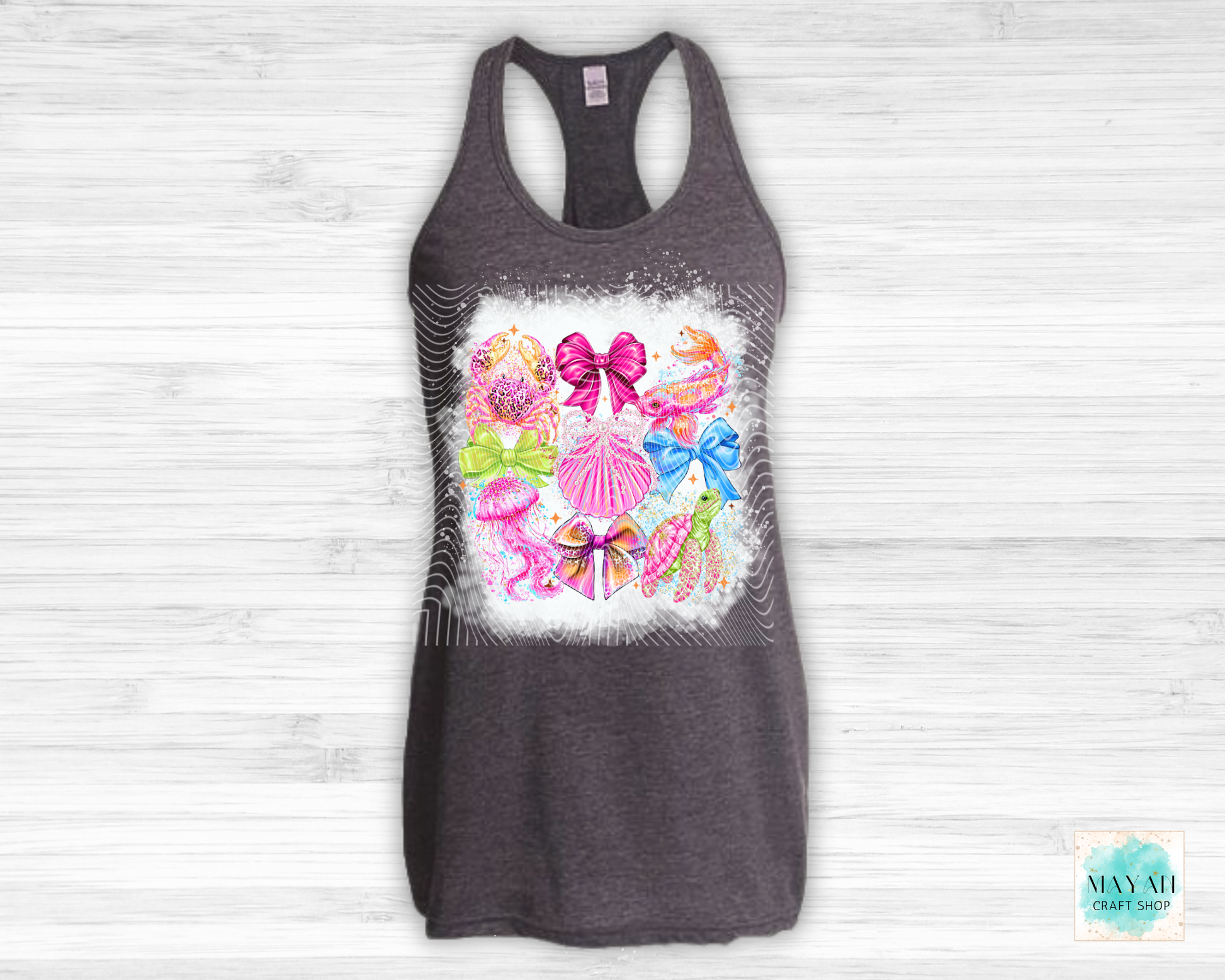 Gray tank top with colorful bow design on a white wooden background