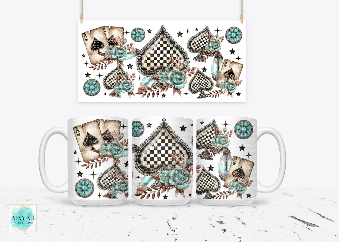 Mugs with decorative playing card design on a white surface