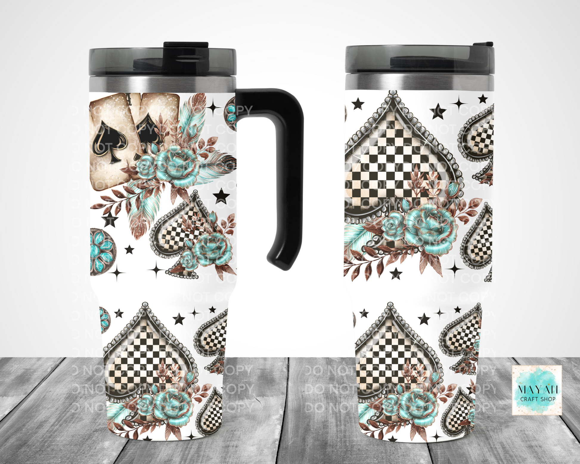 Two travel mugs with decorative patterns on a wooden surface.
