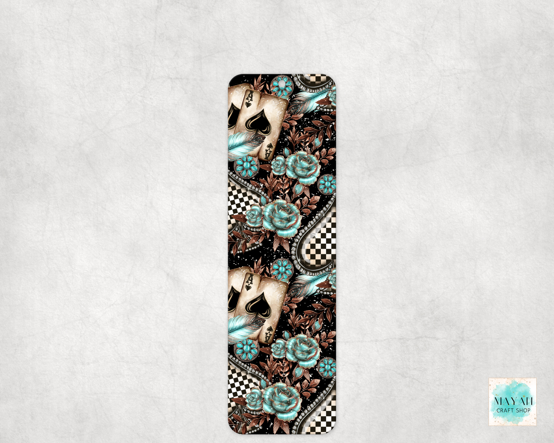 Decorative bookmark with floral and western design on a textured gray background